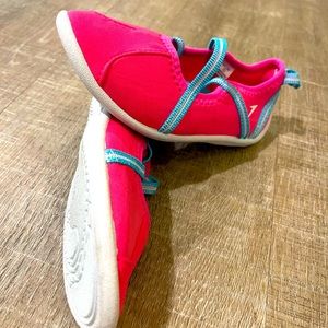 Bright pink with blue elastic straps swim shoes. New with no tags